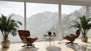 Office with ceiling to floor double glazing windows looking out to mountains.